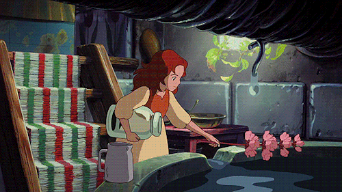 animated gif of an anime scene in a basement where a girl adds water from a well and and pink flowers to a glass jar