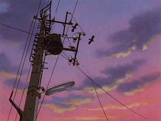Anime-style animated illustration of a utility pole with tangled wires and a streetlamp silhouetted against a dramatic purple and pink sunset sky flickers on. A few black birds are flying above.