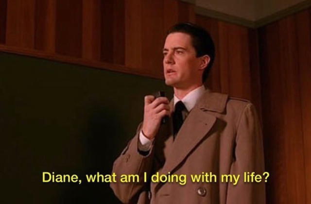 Agent Dale Cooper in a tan trench coat holds a small voice recorder to his mouth with a pensive expression. Yellow subtitles at the bottom read, "Diane, what am I doing with my life?"